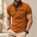 Orange-brown polo shirt with black collar and pocket trim worn against an ivory background