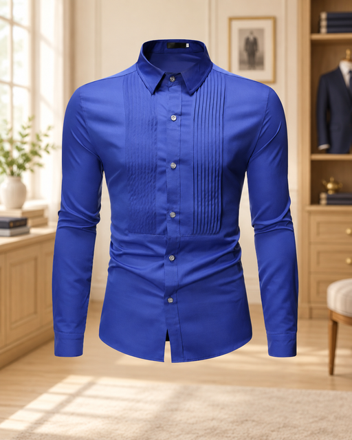 Royal blue tuxedo shirt with pleated front and long sleeves displayed in a softly lit dressing room.