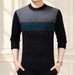 Navy sweater with grey shoulder panel and blue chest stripe.