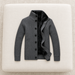 Complete dark-grey lined cardigan on an ivory upholstered bench