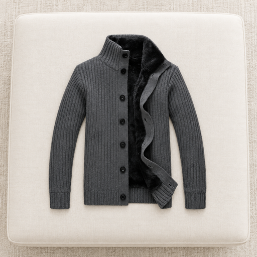 Complete dark-grey lined cardigan on an ivory upholstered bench