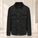 Black four-pocket jacket with silver snaps against an ivory backdrop.