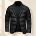 Black quilted blazer with knit lapel facing displayed against a warm ivory wall.