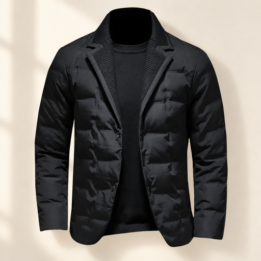 Black quilted blazer with knit lapel facing displayed against a warm ivory wall.