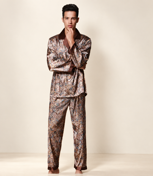 Man wearing patterned pajama set against ivory background