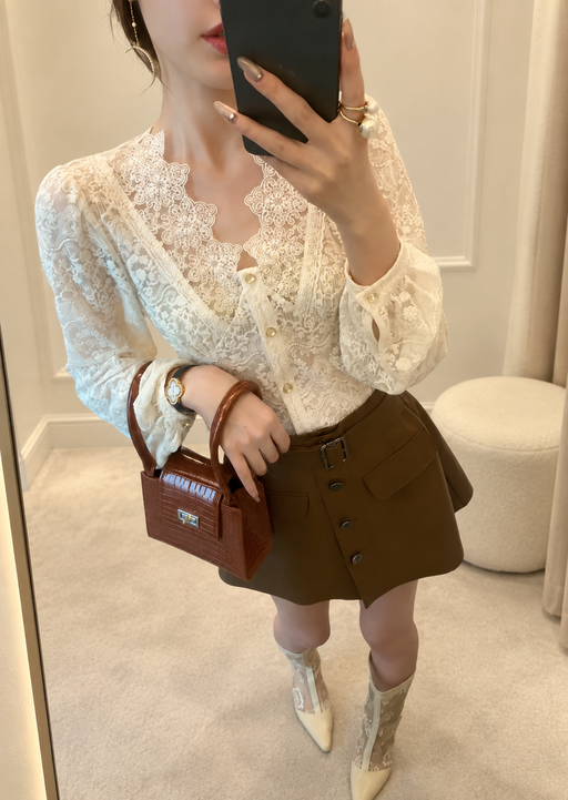Cream lace blouse with scalloped neckline and gold buttons