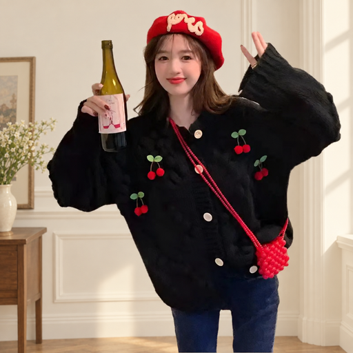 Black cherry knit cardigan worn with a red hat and small red shoulder bag