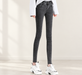 Charcoal skinny jeans with white sneakers in an ivory interior