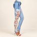 Light blue jeans with white floral lace side panel