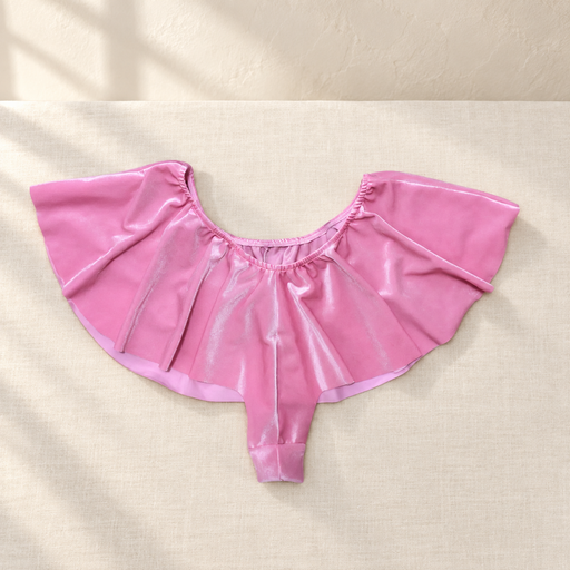 Pink satin skirt shorts laid flat on ivory linen