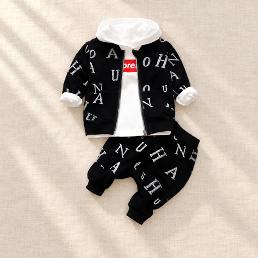 Black letter-print jacket and trousers with a white hooded top on ivory linen