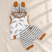 Feather-print hooded top and striped shorts with mustard trim on ivory linen