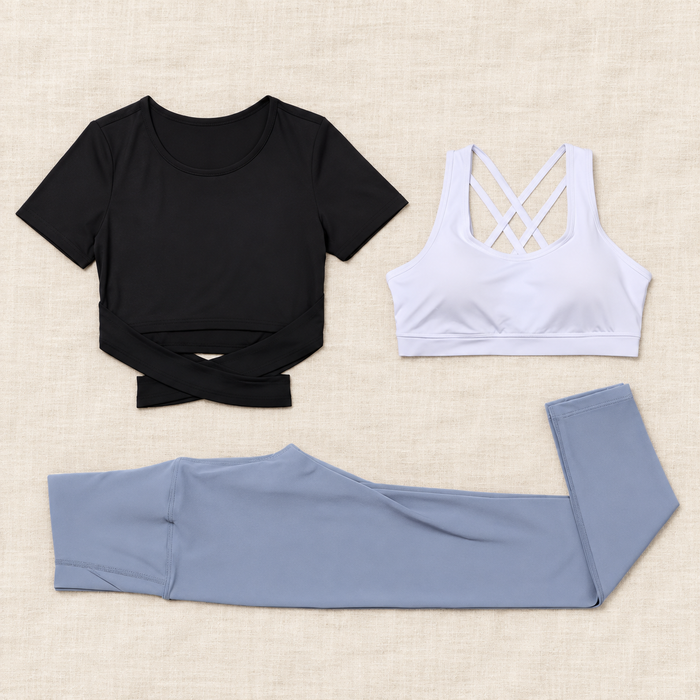 Three-piece sports set displayed on ivory linen