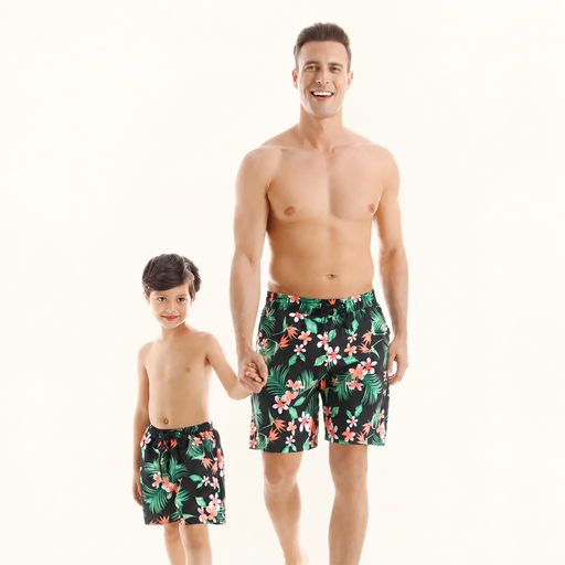 Matching floral swim shorts worn by parent and child