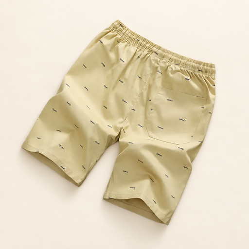 Pale yellow printed beach shorts with an elastic waistband and rear pocket
