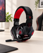 Black and red SY830 headset with an extended microphone on an ivory desk.
