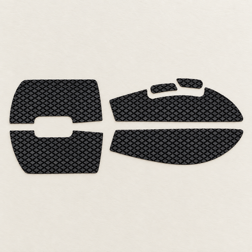 Six black textured mouse grip stickers on an ivory desk