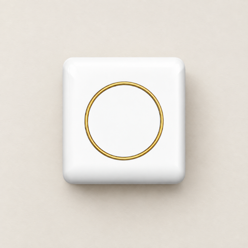 White mini label printer with gold ring on an ivory desk
