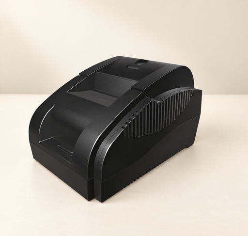 Black thermal receipt printer on an ivory tabletop.