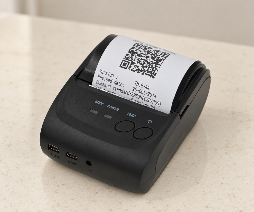 Black portable receipt printer on ivory countertop
