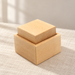 Wooden cube and matching box on ivory linen