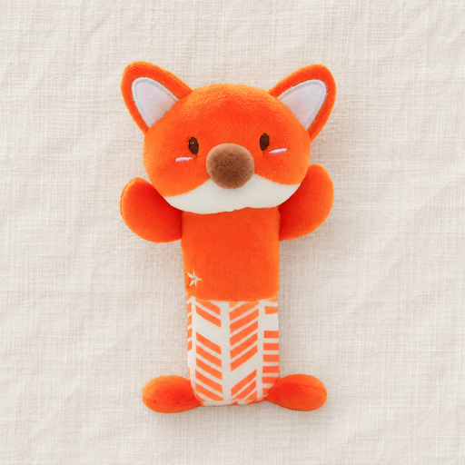 Orange fox plush rattle on ivory linen