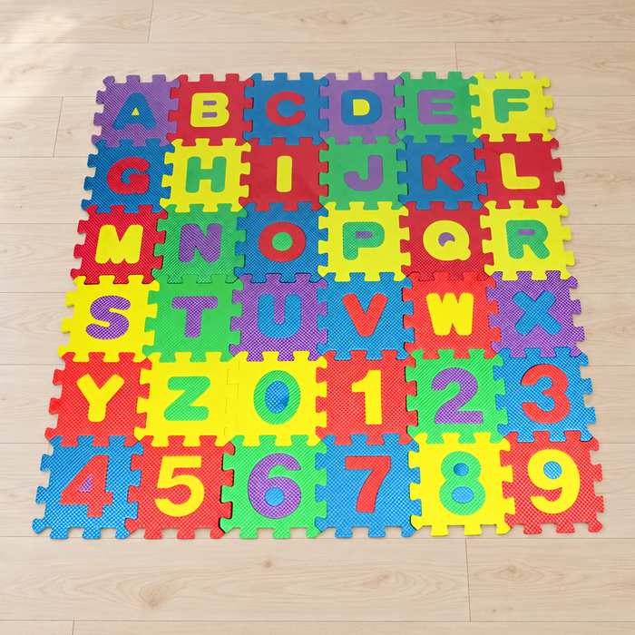Colourful alphabet and number foam puzzle mat on a pale wood floor