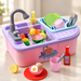 Pink and purple toy sink set on an ivory tabletop