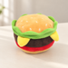 Plush hamburger toy on an ivory tabletop