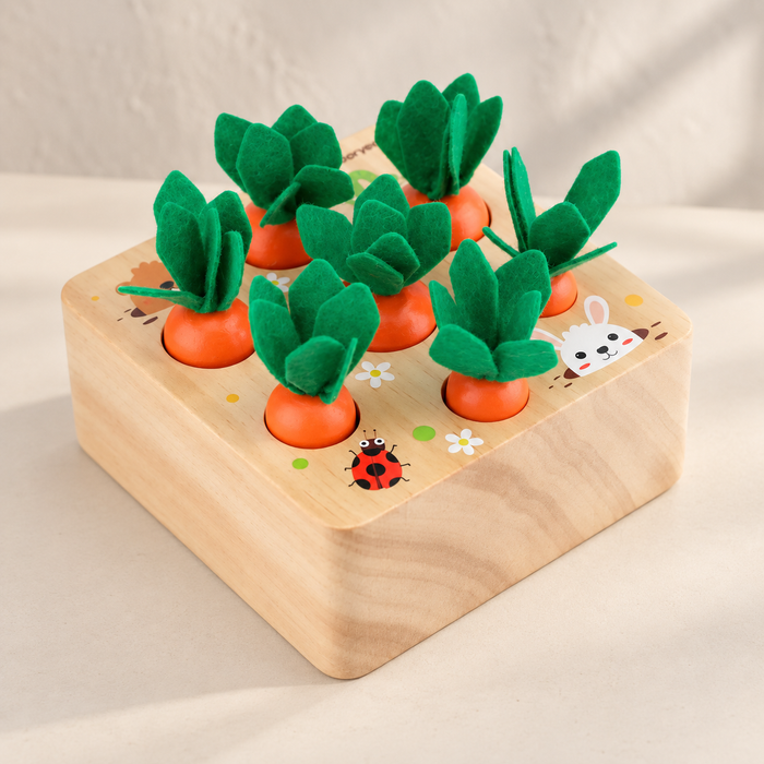 Wooden carrot sorting toy on an ivory tabletop
