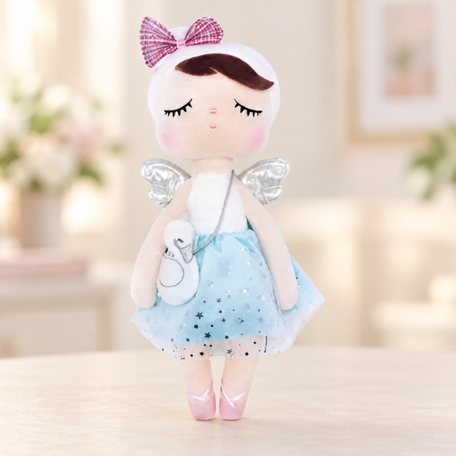 Angel plush doll with a blue star skirt, swan purse and pink bow on a pale tabletop
