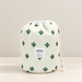 Pale cream drawstring cosmetic pouch with green cactus print on an ivory surface.