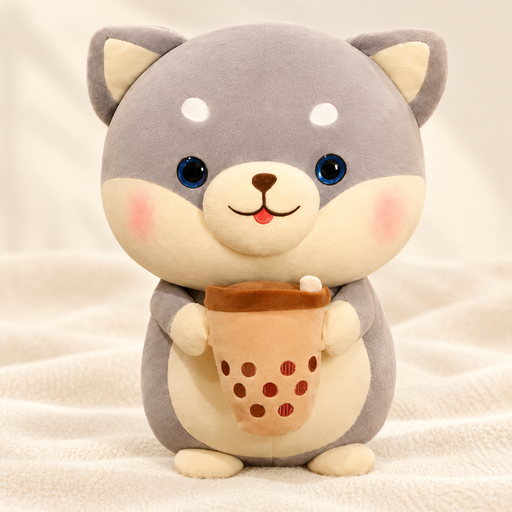 Grey Shiba plush holding a tan bubble-tea cup on ivory fabric.