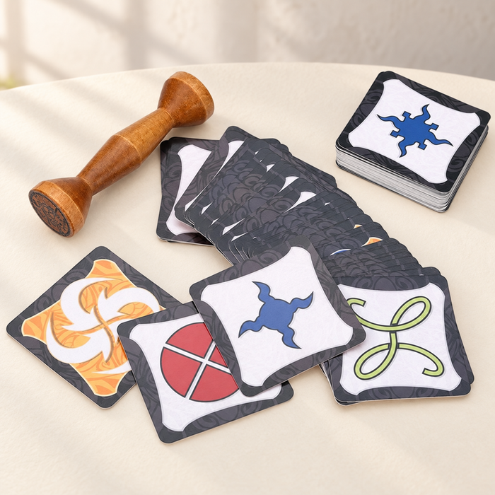 Wooden totem and colourful reaction cards arranged on an ivory tabletop.