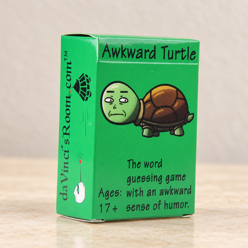 Green Awkward Turtle card game box on an ivory surface