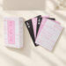 Pink and white playing card box with a fan of four aces and a patterned card back.
