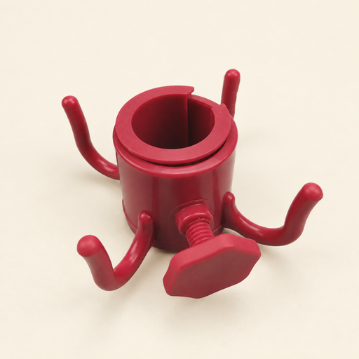 Burgundy four-hook umbrella pole hanger on an ivory surface