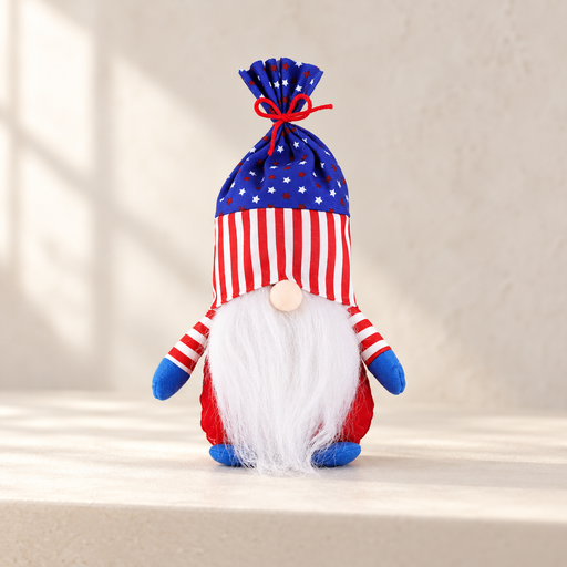 Red plush gnome with a star-and-stripe hat, white beard and blue mittens on an ivory shelf.