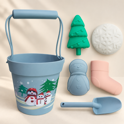 Blue Christmas-themed bucket and shovel with four silicone moulds on a light surface