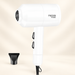 White hair dryer with separate black concentrator nozzle against an ivory background