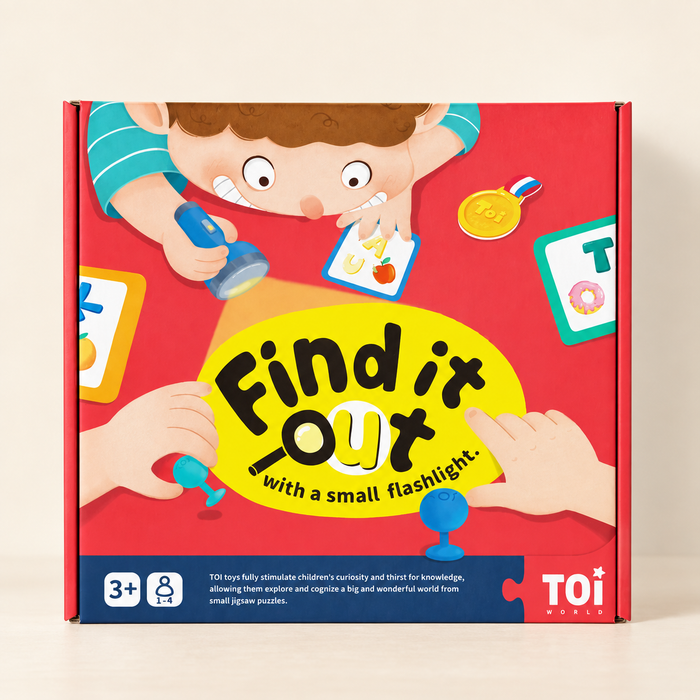 Red Find it out picture-search game box on an ivory tabletop.