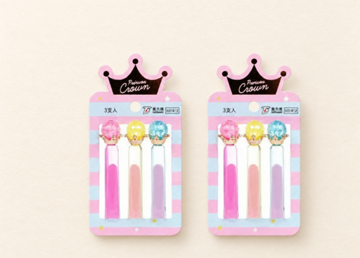 Two Crown display cards, each holding pink, yellow and blue pencil toppers.