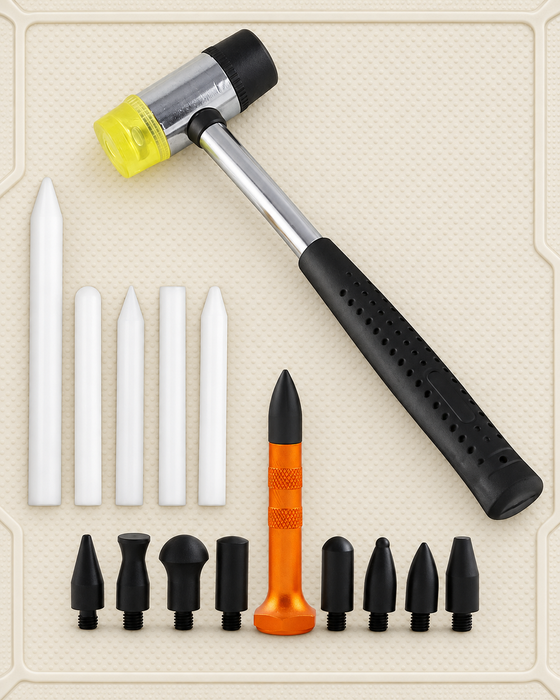 Dent repair kit with a dual-face hammer, white rods and interchangeable black tips on an ivory mat.