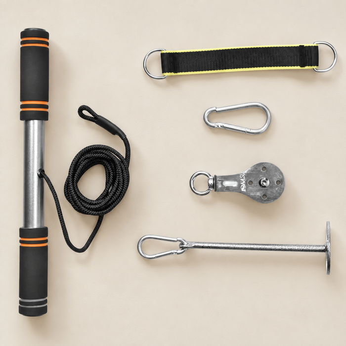 Cable pulley workout components arranged on an ivory worktable.