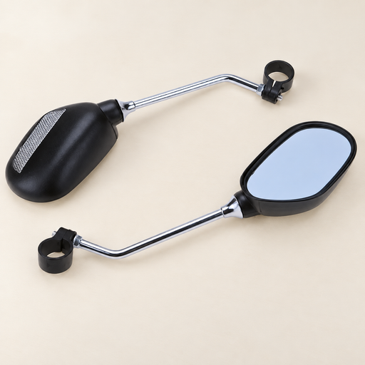 Two black bicycle mirrors with silver stems and handlebar clamps on an ivory worktable.