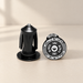 Black bicycle handlebar end plugs with silver bolts and white circular lettering