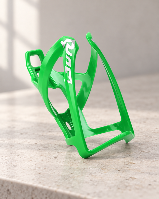 Green bicycle bottle cage with white markings on a pale stone counter.