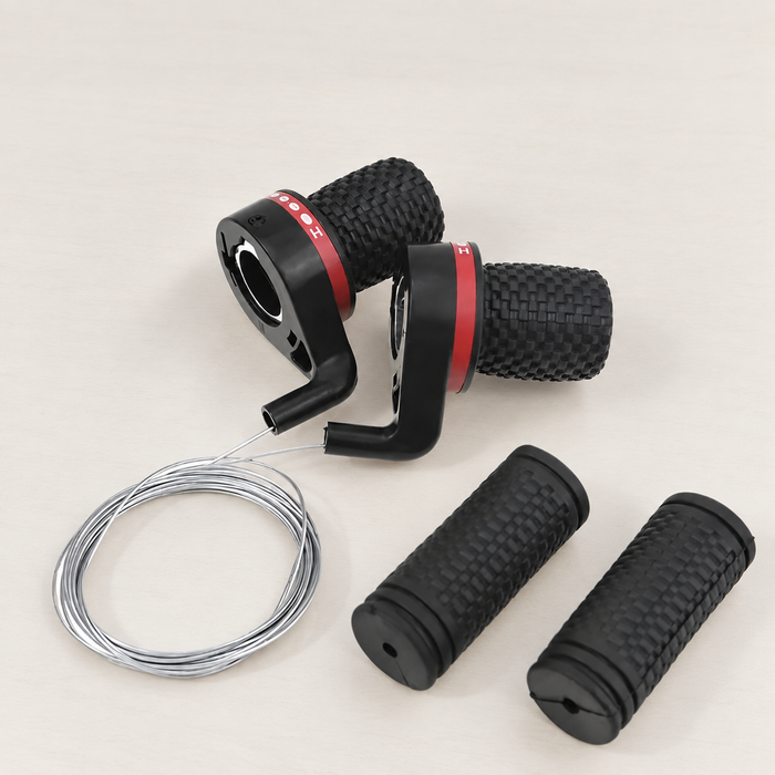 Black bicycle twist shifter set with red bands and cables