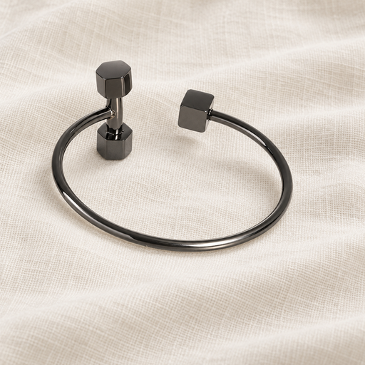 Dark metallic open dumbbell bangle on ivory linen