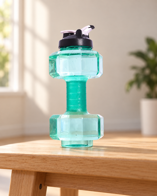 Green dumbbell-shaped water bottle with a dark lid and white flip spout on a wooden bench.